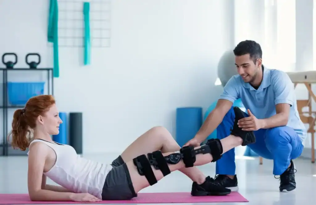 Woman having treatment to help muscle recovery East Grinstead after an injury
