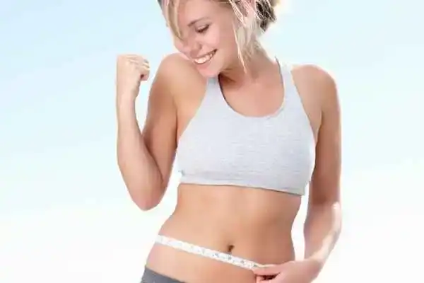 Unraveling the Mystery: Where Does the Body Fat Loss From First? 3 Image of woman happy with fat loss East Grinstead